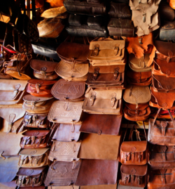 A display of leather bags from a leatherworking shop.